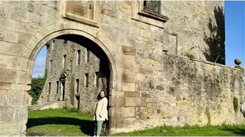 Connie at a castle doorway in Scotland